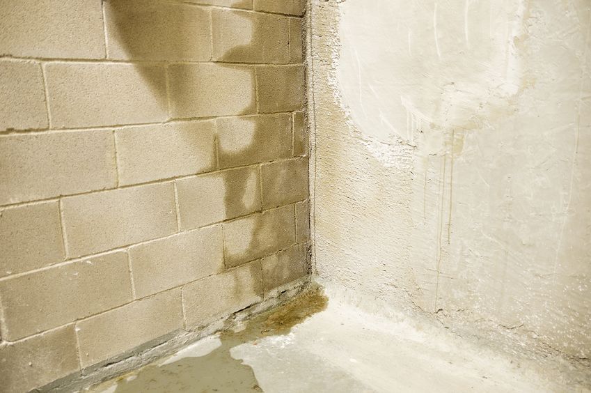 Basement moisture and cracks in foundation wall caused by air and water infiltration